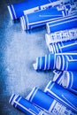 Set of blue rolled construction plans on metallic background mai Royalty Free Stock Photo