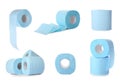 Set with blue rolls of toilet paper on background