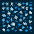 Set of blue snowflakes falling in different perspective, angles,directions isolated on dark background. Christmas, New Royalty Free Stock Photo