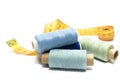 A set of blue threads for sewing and a centimeter on a white background Royalty Free Stock Photo