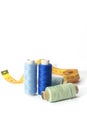 A set of blue threads for sewing and a centimeter on a white background Royalty Free Stock Photo