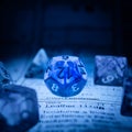 Set of blue transparent dice focused on the d12 Royalty Free Stock Photo