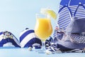 Set of blue white summer beach things in nautical style for vacation with orange cocktail on blue long background, space for text Royalty Free Stock Photo