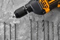 Set of borers and drill, concrete background