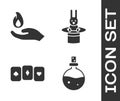 Set Bottle with love potion, Hand holding a fire, Playing cards and Magician hat and rabbit icon. Vector Royalty Free Stock Photo