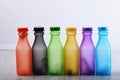 Set of bottles in different color. Row of colorful drinks Royalty Free Stock Photo