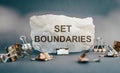 Set boundaries, text words typography written on torn paper