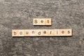 set boundaries word written on wood block. set boundaries text on table, concept