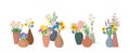 A set of bouquets of spring flowers in clay vases.Vector illustration