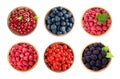 Set of bowls with different fresh berries on background, top view Royalty Free Stock Photo