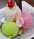 Set of bowls with various colorful Ice Cream scoops with different flavors and fresh ingredients, chocolate, vanilla, and