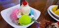 Set of bowls with various colorful Ice Cream scoops with different flavors and fresh ingredients, chocolate, vanilla, and