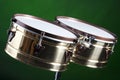 Set of Brass Timbales Isolated on Green Royalty Free Stock Photo
