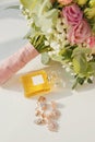 Set bride\'s accessories: perfume bottle, bride\'s bouquet, earrings, pendant and chain. Soft focus