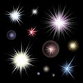 Set of bright glowing colorful stars burst on black background Royalty Free Stock Photo