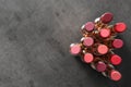 Set of bright lipsticks on grey background, flat lay