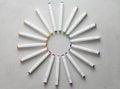 A set of bright multi-colored felt-tip pens or markers lie in a circle, rays, creating a round frame in the center. Creativity,