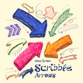 Set of bright scribble arrows hand-drawn on a light background. Royalty Free Stock Photo