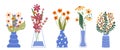 Set of bright spring flowers in vases and bottles isolated on a white background. Cartoon flat vector illustration. Royalty Free Stock Photo