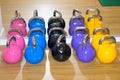 Set of brightly colored kettle weights in a gym