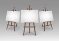 Set of Brown Wooden Easels with Blank Canvases