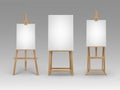 Set of Brown Wooden Easels with Blank Canvases