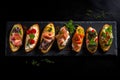 Set of bruschetta with salmon, prosciutto, mozzarella and basil on black background Royalty Free Stock Photo