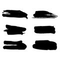 Set of brush strokes hand drawn vector black ink stains isolated on the white. Royalty Free Stock Photo