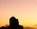 Set of buildings in silhouette, at dusk, just before sundown