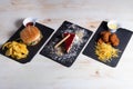 Set with burger, croquetes and cheese cake Royalty Free Stock Photo