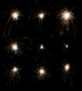 Set of burning sparklers on black background. Royalty Free Stock Photo