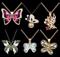 Of a set of butterfly pendants with precious stone