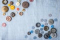 Set of buttons on the blue fabric top view Royalty Free Stock Photo