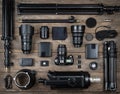 Set of the camera and photography equipment lens, tripod, filter, flash, memory card, hard desk, reflector on wood desk. Royalty Free Stock Photo