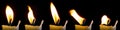 A set of candle flames isolated on a black background, a collection of five images to overlay on your photos.