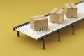 set of cardboard boxes on a conveyor belt on a yellow background Royalty Free Stock Photo