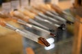 Set of carving tools, carpenter equipment on glass table - close up view