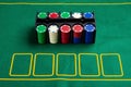 Set of cashino chips on green table