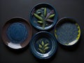 Set of ceramic plates on a dark background. View from above. Royalty Free Stock Photo