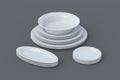 Set of ceramic plates on gray background Royalty Free Stock Photo