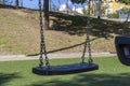 Set of chain swings on modern kids playground Royalty Free Stock Photo