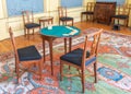 Set of chairs and a table with a card game, at a Dutch museum Royalty Free Stock Photo