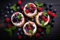 Set of cheesecake cakes with raspberries, blackberries and blueberries