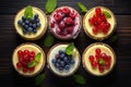 Set of cheesecake cakes in tartlets with fresh berries