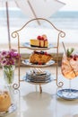 Set of cheesecake, honey toast and beverage served in cake stand on the table in cafe Royalty Free Stock Photo