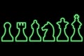 Set of chess figures on black background. Simple neon green outline. Vector illustration Royalty Free Stock Photo