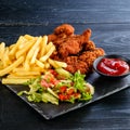 Set of chicken nuggets, salad and french fries Royalty Free Stock Photo