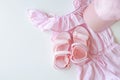 Set of children`s clothes for girls in pink style. Sandals, cap and t-shirt, flat lay, top view Royalty Free Stock Photo