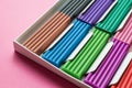 Set for children`s creativity - multi-colored plasticine on a pink background. Close-up Royalty Free Stock Photo