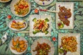 set of chinese food dishes in a restaurant. Rice pasta tongues, chicken with almonds, roast duck, udon noodles, caramelized beef Royalty Free Stock Photo